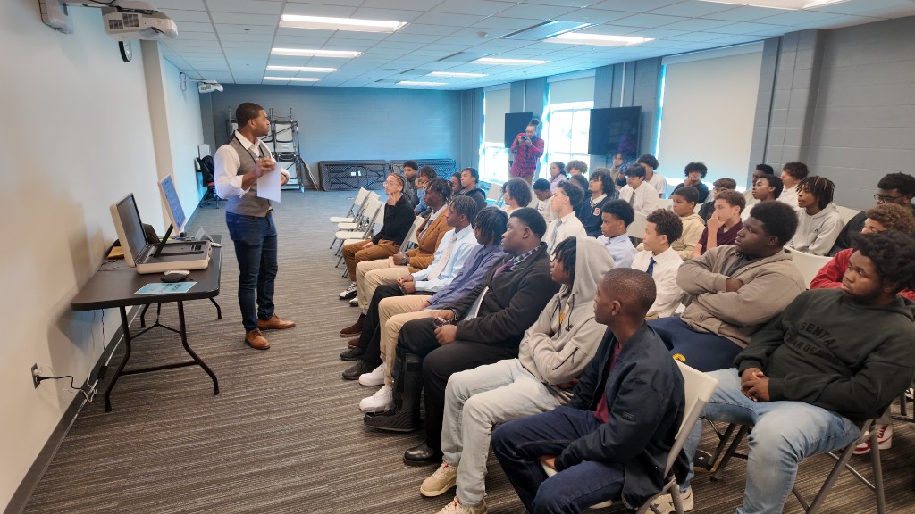 Mentoring session — speaker and youth at the Dome
